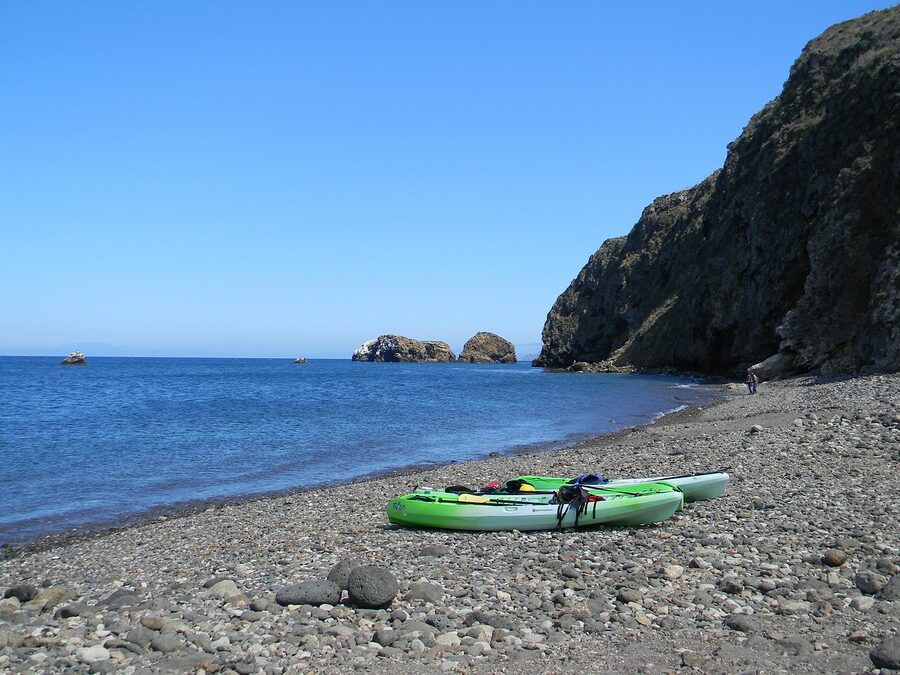 Sit-on-top kayaks on a beach