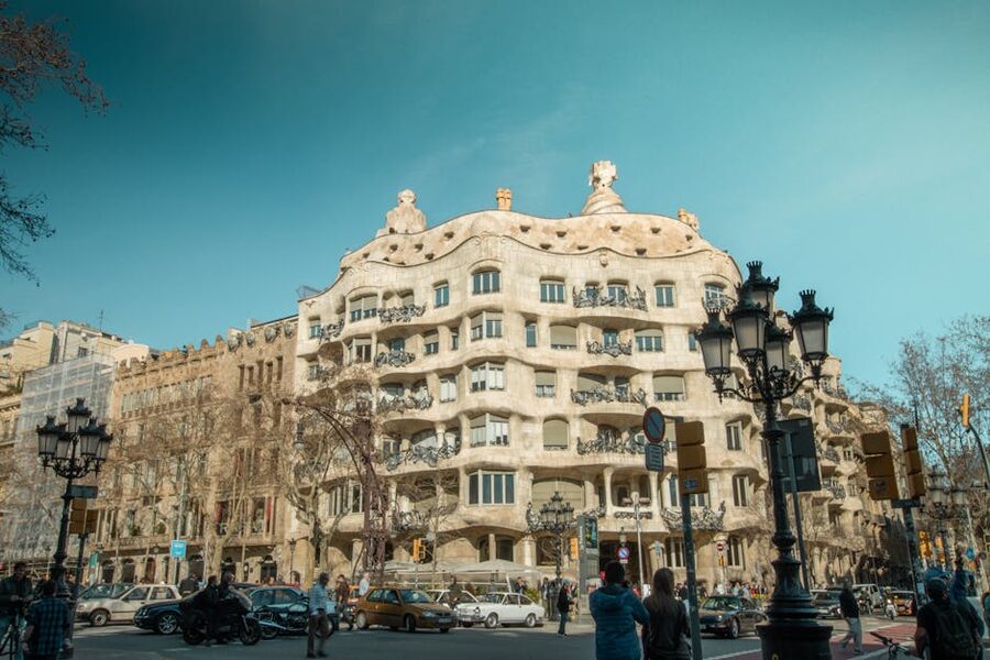 Casa Milà corner Passeig de Gràcia with traffic