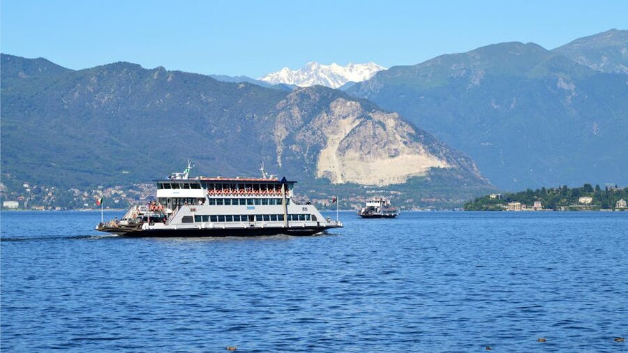 Passenger ferry on Lake Como with mountain backdrop