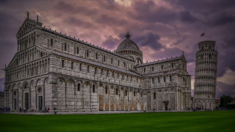 Distant view of the Leaning Tower of Pisa with surrounding buildings