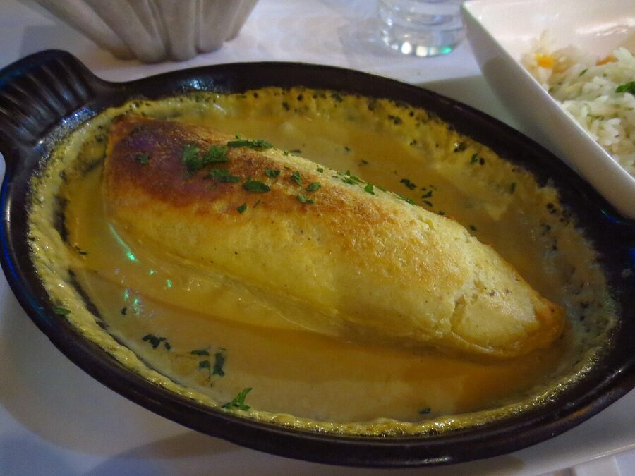 Quenelle de brochet, pike fish dumpling in Nantua sauce, the signature dish of Lyon