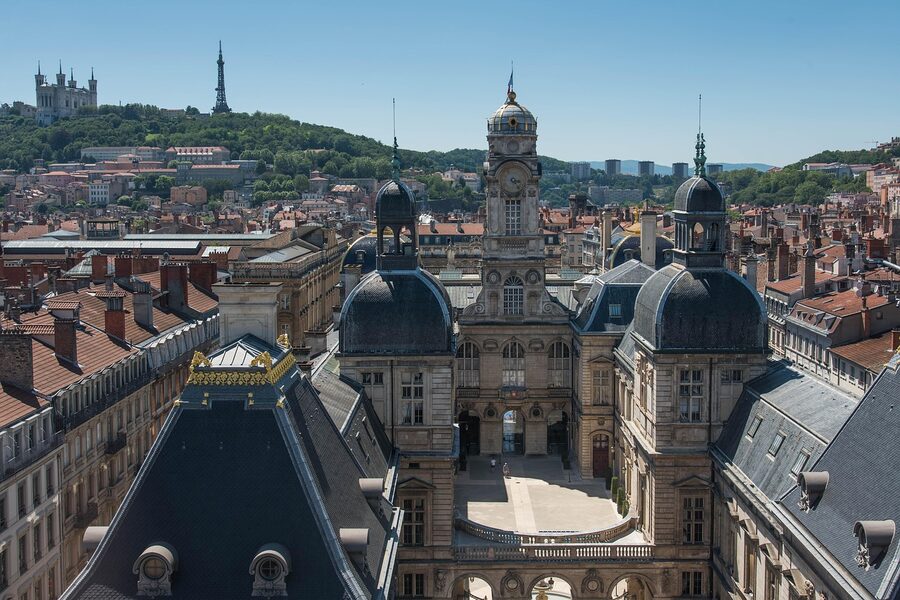 Lyon rooftops with Fourviere basilica and the Hotel de Ville town hall in view