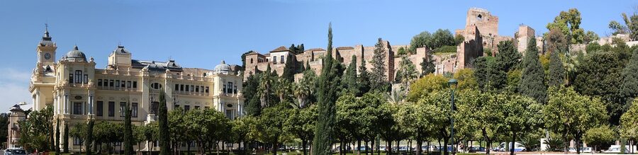 Wide panorama of the Alcazaba Malaga castle complex with port