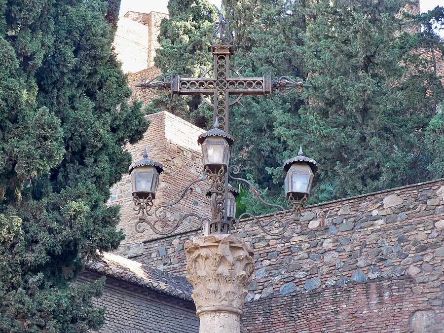 Cross marking the 1487 Christian conquest at the Alcazaba Malaga tower