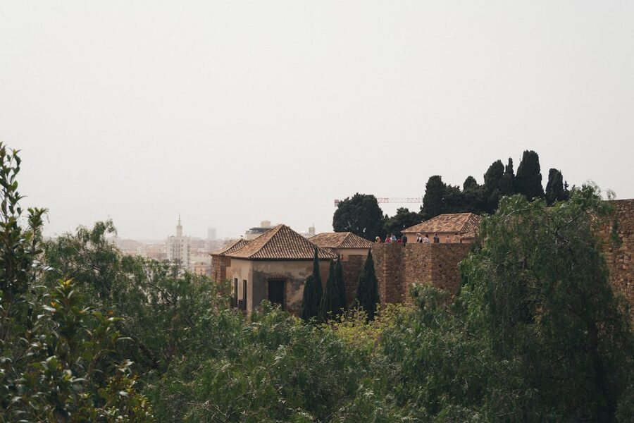 Historic stone walls and rooftops of the Alcazaba Malaga seen from above