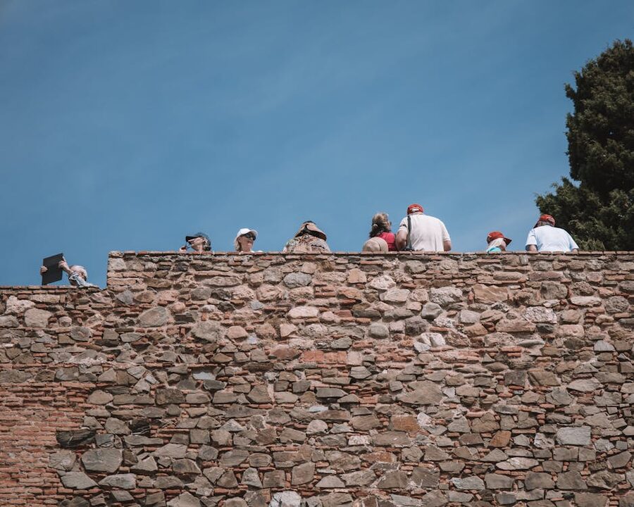 Visitors walking along the Alcazaba Malaga walls