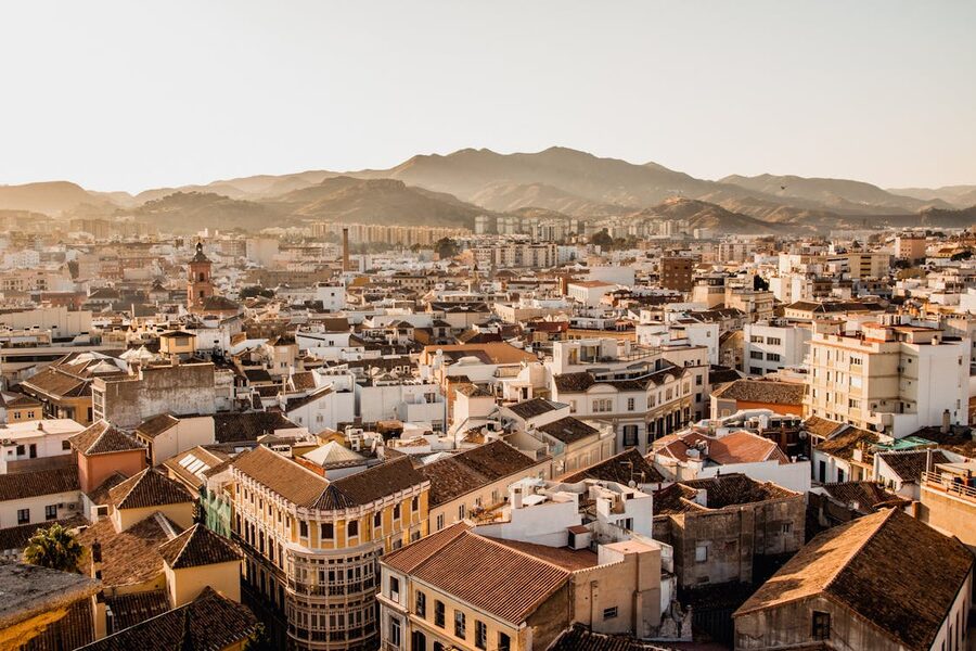 Malaga cityscape and mountains at sunset