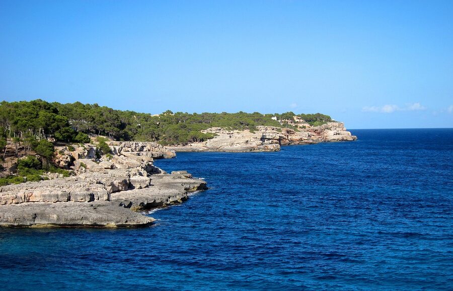 Mallorca cala cove with clear water and small island