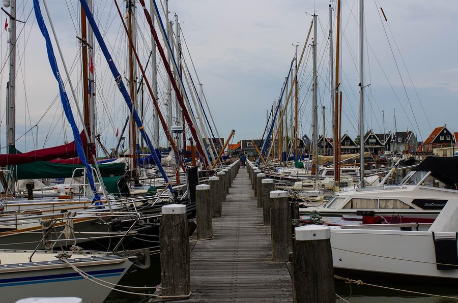 Traditional Marken village street with Dutch flags