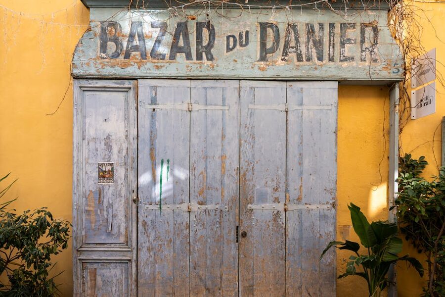 Rustic wooden door of the Bazar du Panier shop