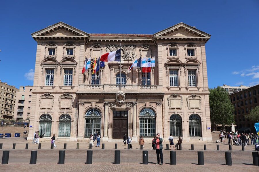 Marseille City Hall with flags on the harbour quay