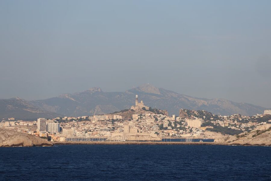 Marseille and Notre Dame de la Garde with mountains in the distance