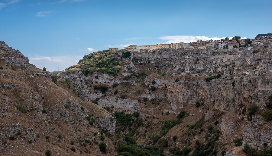 Wide view of Sassi di Matera with stone dwellings cascading down the ravine