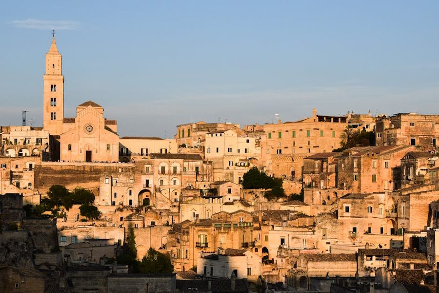 Matera Sassi at sunset with historic stone buildings glowing