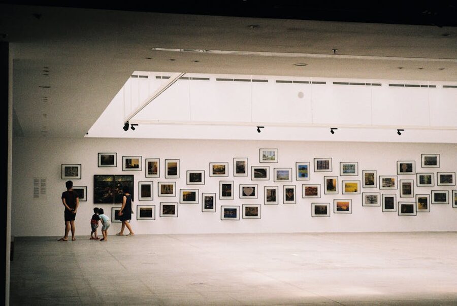 Family viewing exhibition in modern museum gallery