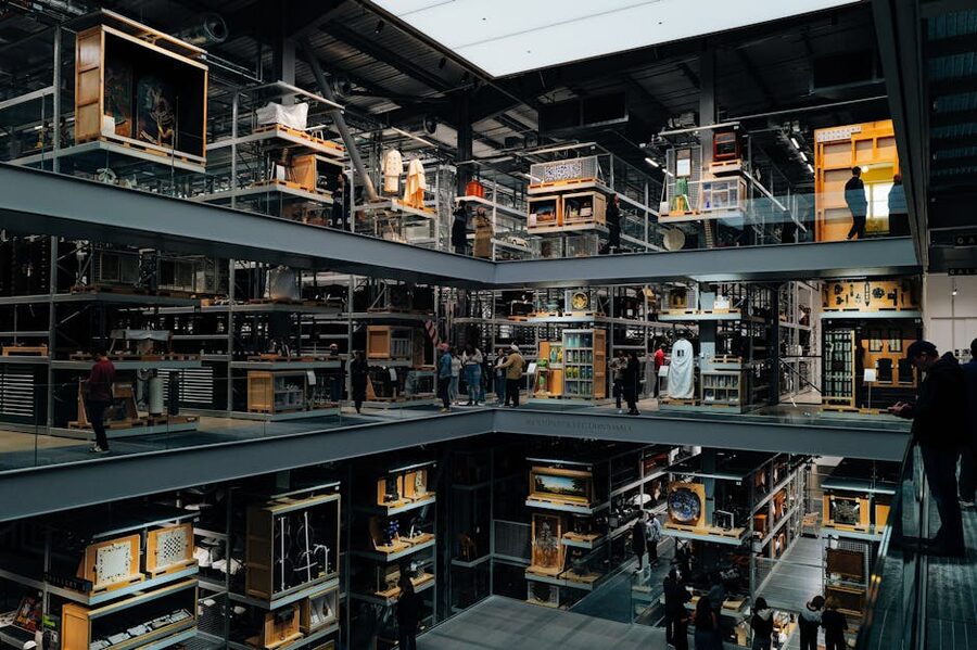 Modern art museum interior with multiple floors and visitors
