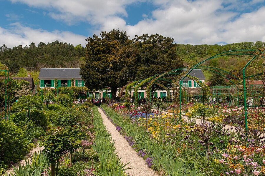 Pink stucco walls and green shutters at Monet house Giverny
