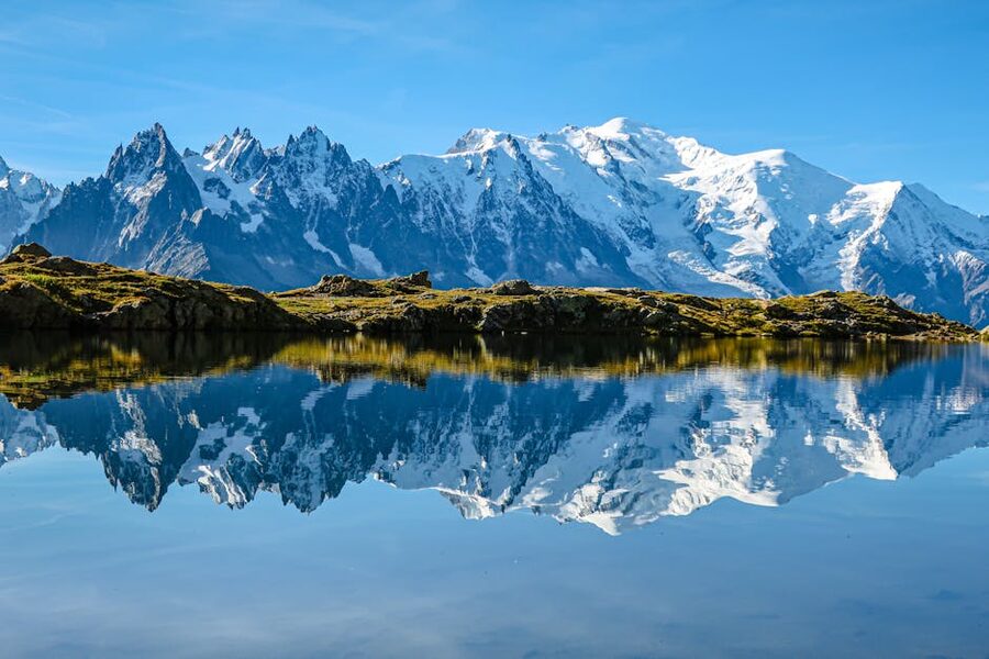 Mont Blanc reflected in a tranquil lake at Chamonix
