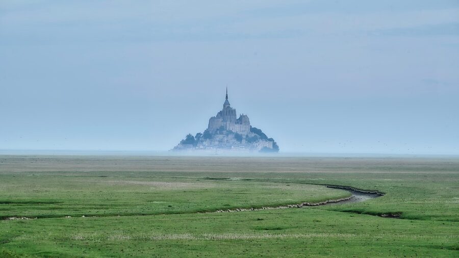 Mont-Saint-Michel rising from morning fog in Normandy