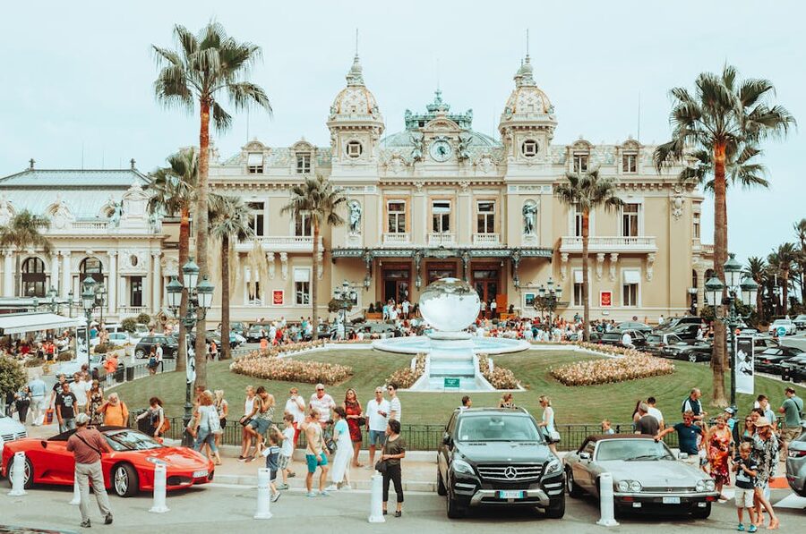 The Monte Carlo Casino main facade with palm trees in the foreground