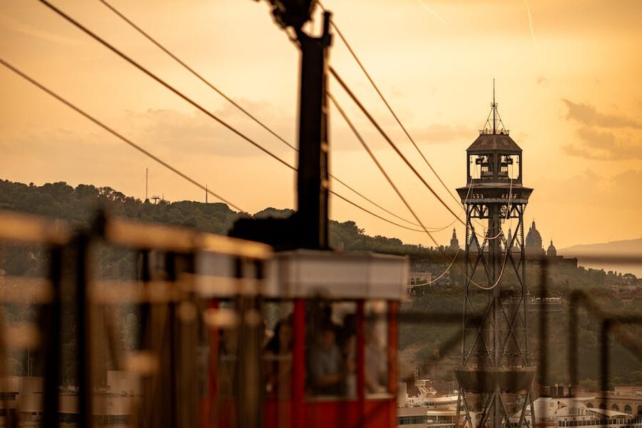 Montjuïc cable car at sunset with Barcelona skyline