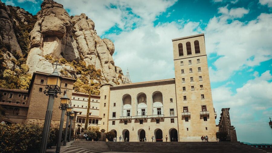 Santa Maria de Montserrat abbey buildings beneath the serrated rock spires