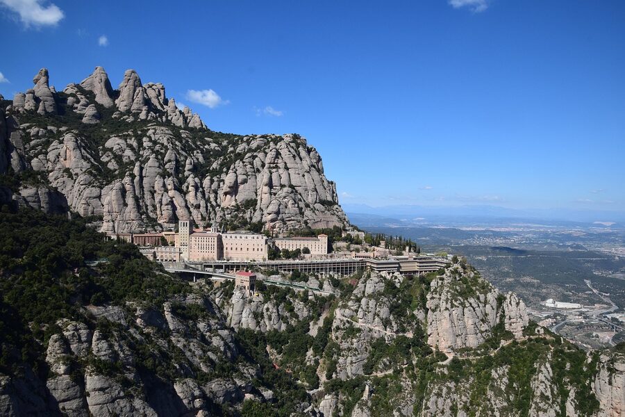 Montserrat rock pillars rising beside the monastery