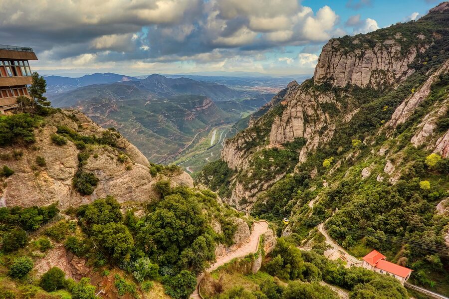 Montserrat monastery surrounded by spring green slopes