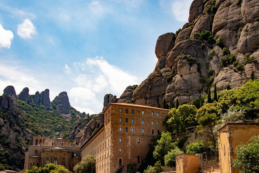 Montserrat monastery stone walls against jagged cliffs