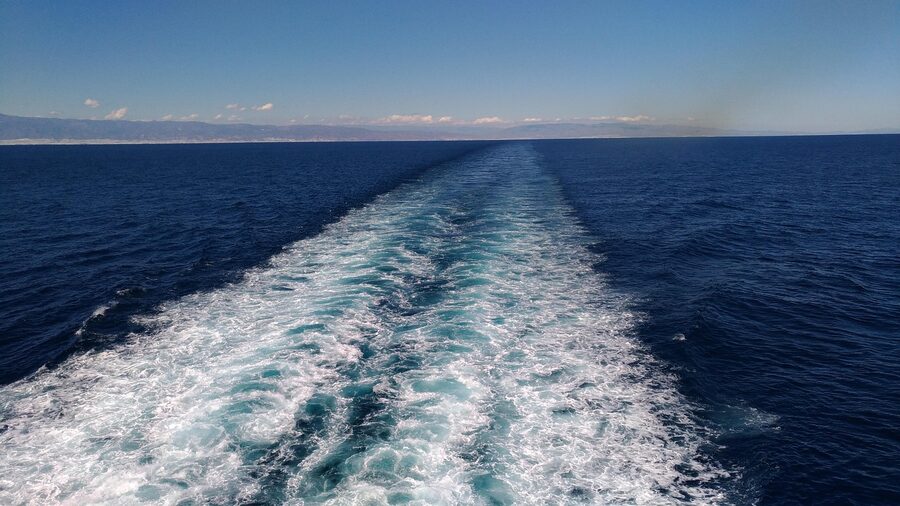 Ferry crossing the Strait of Gibraltar with Morocco coast in distance