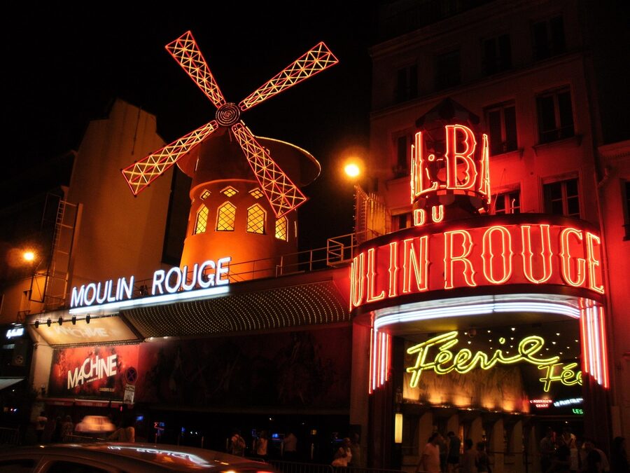 The Moulin Rouge in the early evening with the windmill catching the last light