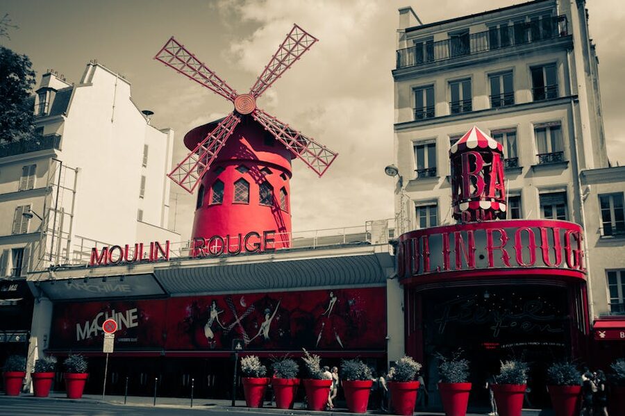 The Moulin Rouge windmill facade in Montmartre Paris