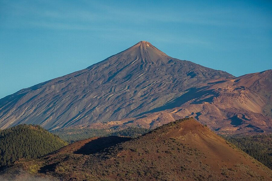 Triangular shadow of Mount Teide cast east on the cloud sea at sunset