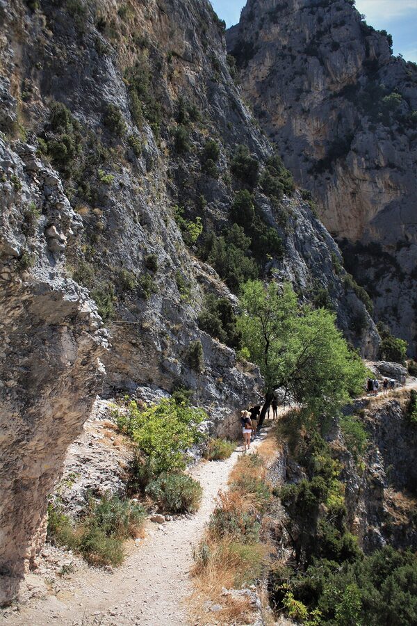 Moustiers-Sainte-Marie medieval village under limestone cliffs in Provence
