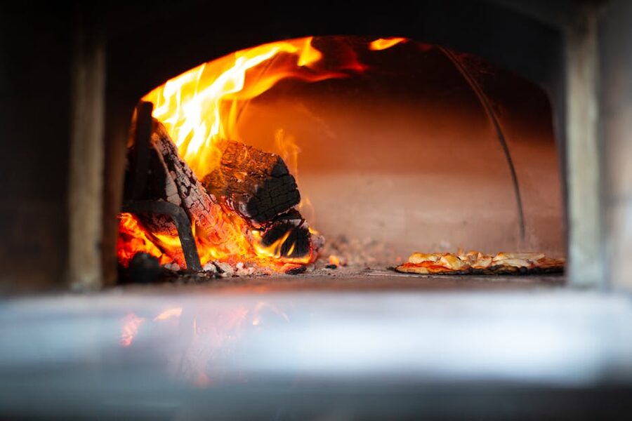 Naples wood-fired pizza oven flames close-up