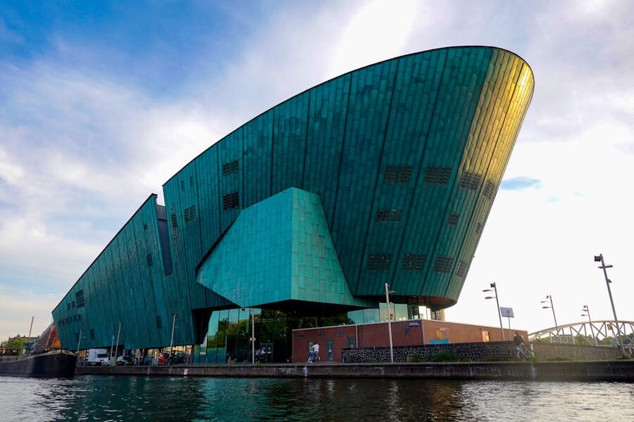 NEMO Science Museum green copper building beside the IJ harbour Amsterdam