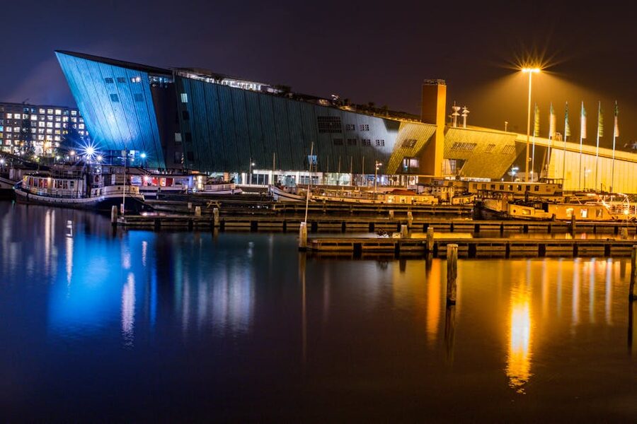 Night view of NEMO Science Museum and harbour reflections in Amsterdam