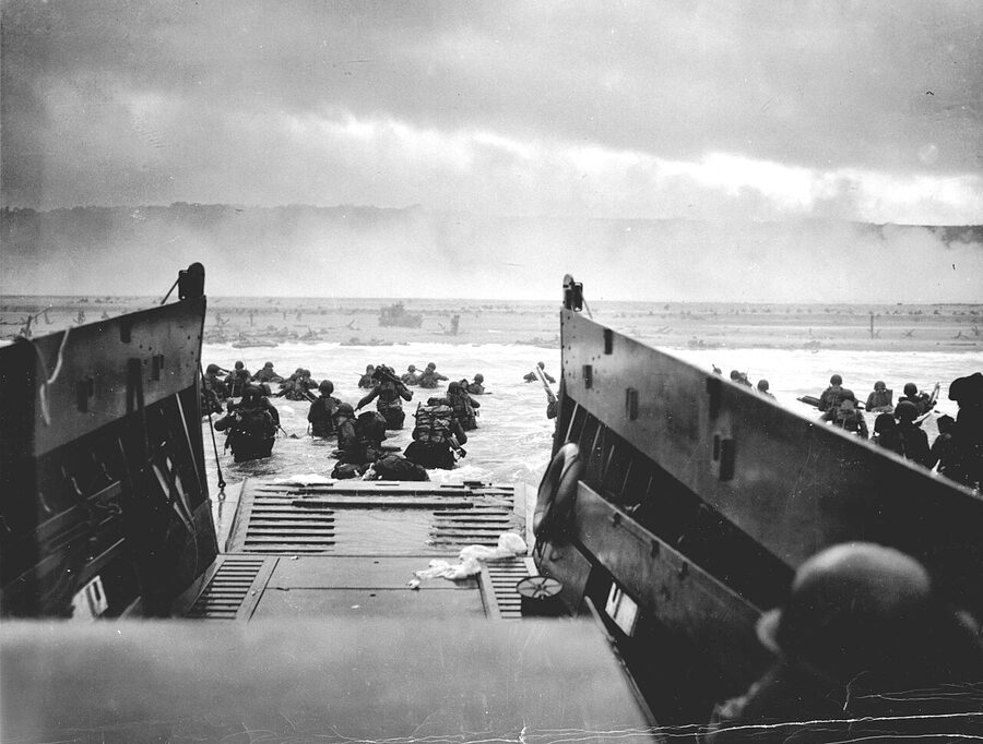 LST Landing Ship Tank disgorging tanks and trucks on a Normandy beach 1944