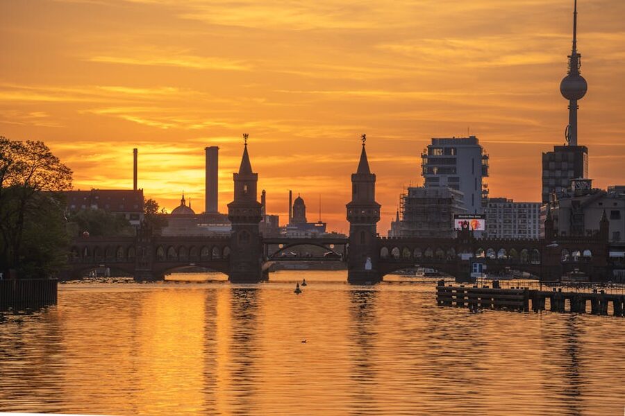 Oberbaum Bridge and TV Tower at sunset on the Spree River