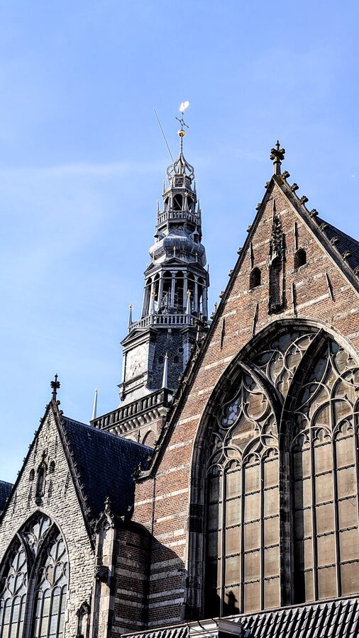 Oude Kerk Gothic facade Amsterdam blue sky