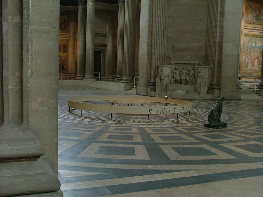 Foucault pendulum at the Panthéon Paris seen from the side with the steel cable visible