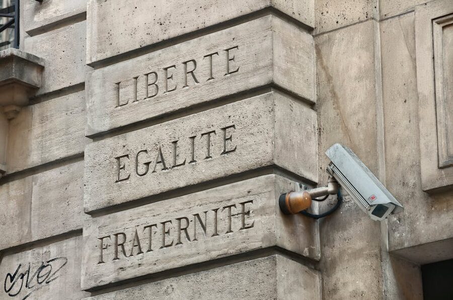 Liberte Egalite Fraternite carved into a Parisian wall