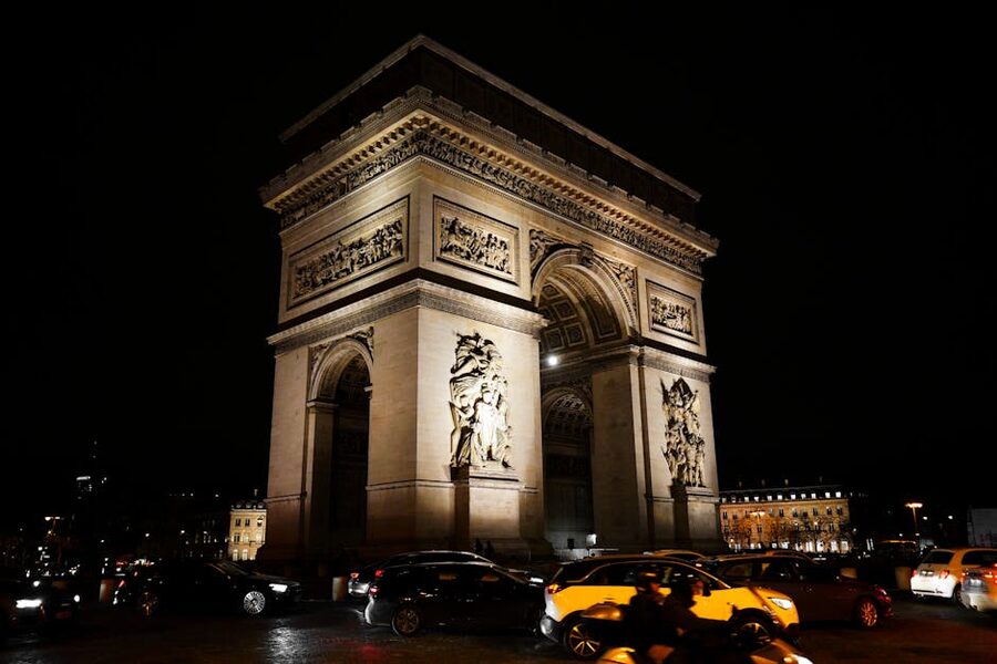Arc de Triomphe illuminated at night in Paris