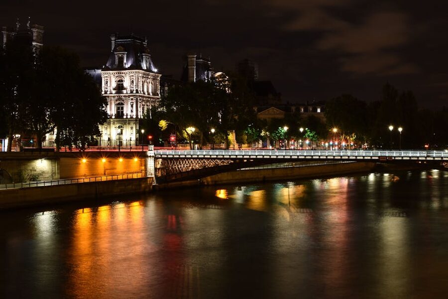 Eiffel Tower at night with Seine River reflections