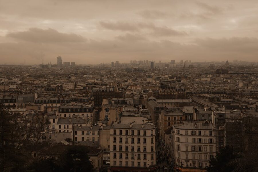 Moody Parisian rooftops under overcast skies