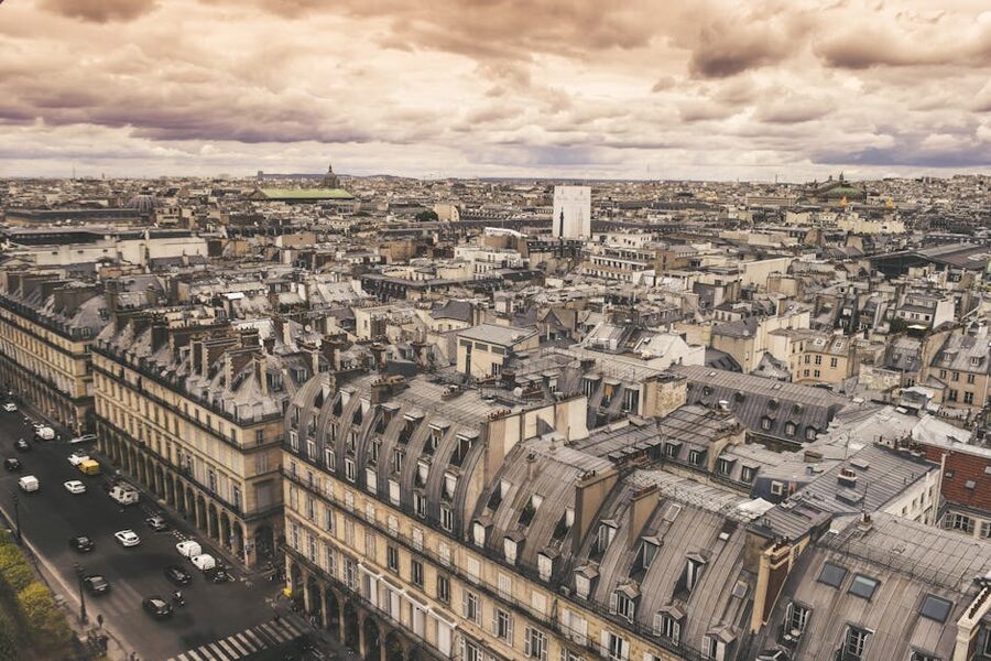 Paris Haussmann era rooftops aerial view at sunset