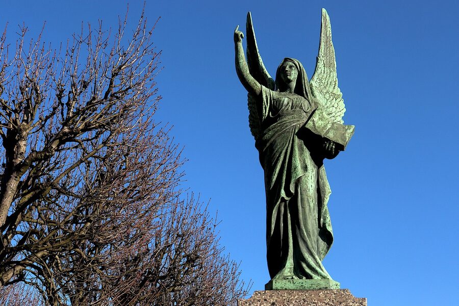 Bronze winged angel funerary sculpture at Pere Lachaise Paris