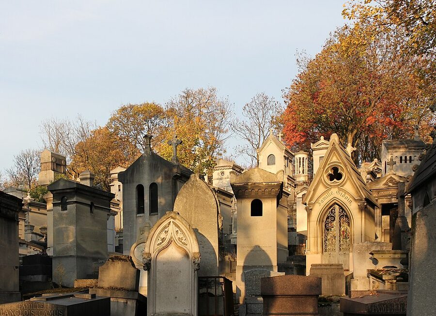 Pere Lachaise Cemetery in autumn with fallen chestnut leaves Paris