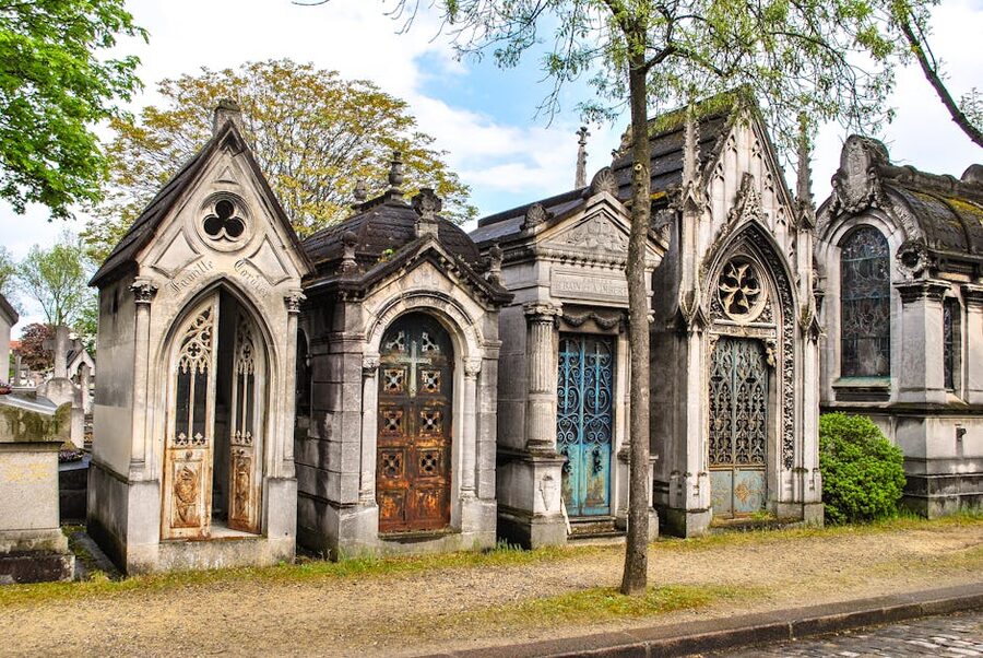 Ornate Gothic Revival mausoleums at Pere Lachaise Cemetery Paris