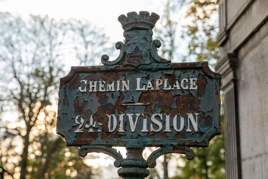 Rusty division signpost inside Pere Lachaise Cemetery Paris